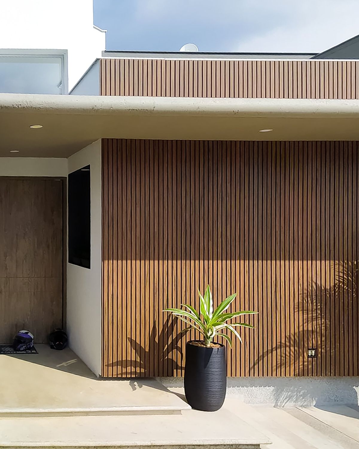 Necowood WPC fluted wall panel in modern living room interior